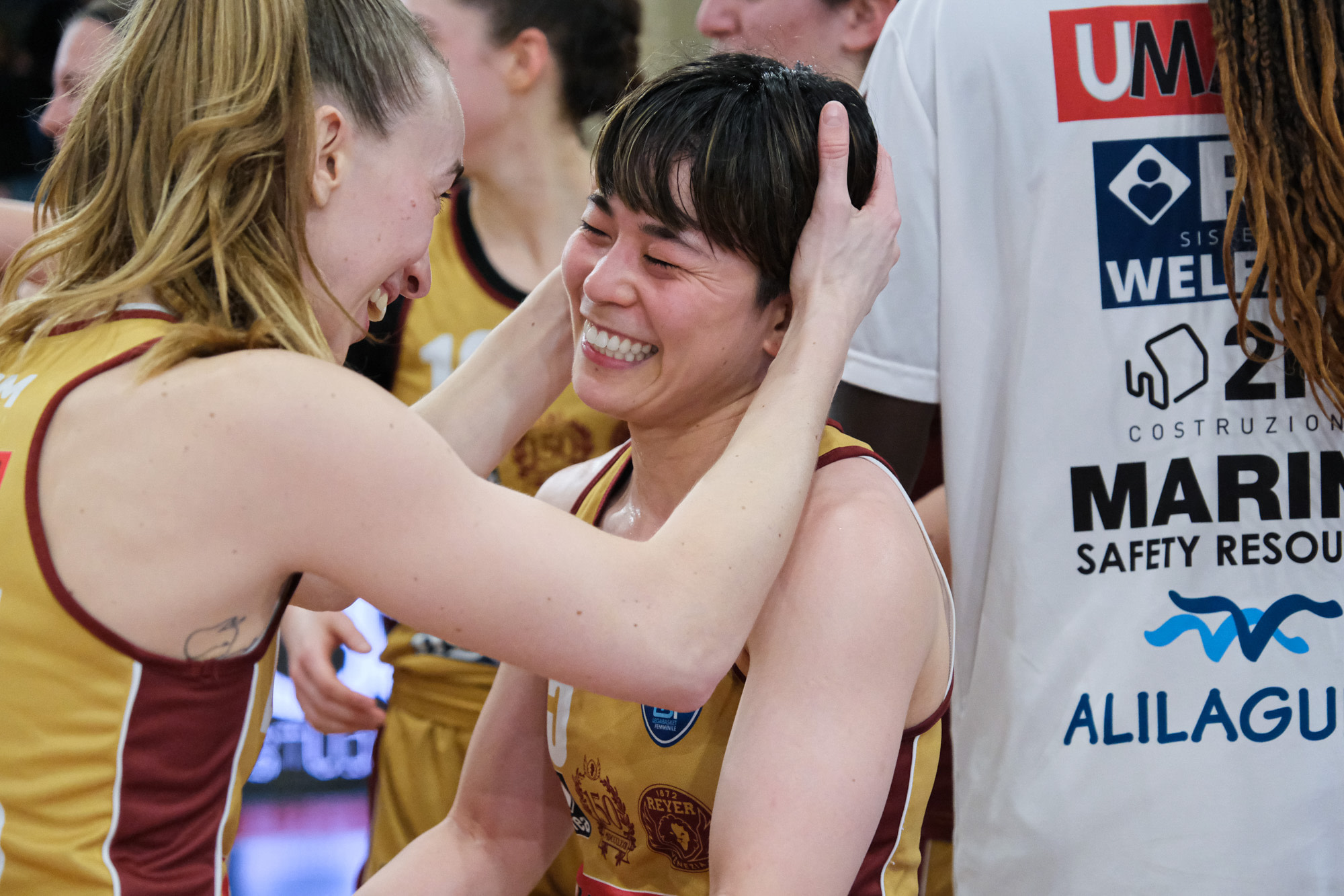 Mariella Santucci and Shiori Yasuma of Umana Reyer Venezia celebreate with the team after winning the match against Virtus Segafredo Bologna during the Final Eight semifinal of the 2023 Italian Cup. Umana Reyer Venezia Team beat Virtus Segafredo Bologna Team with a score of  63 - 78. (Ph. Elena Vizzoca ©Unicode Images)